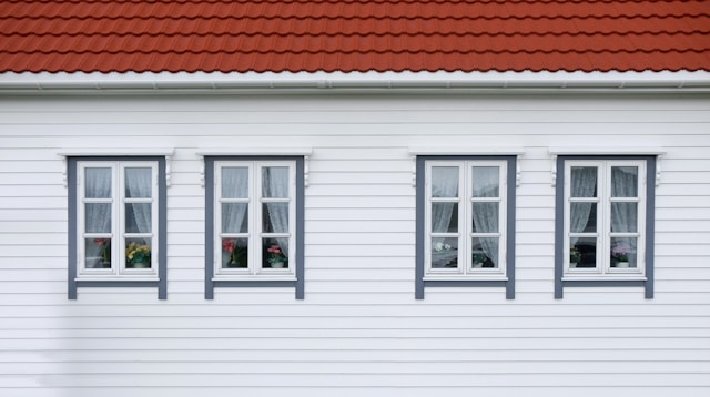 Closed white and red windows of the house